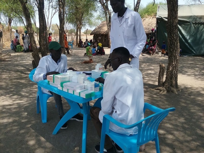 IMA and local partners walked four hours carrying 500 lbs of essential medical supplies to provide a remote IDP community in Ayod County, South Sudan with primary health care.
