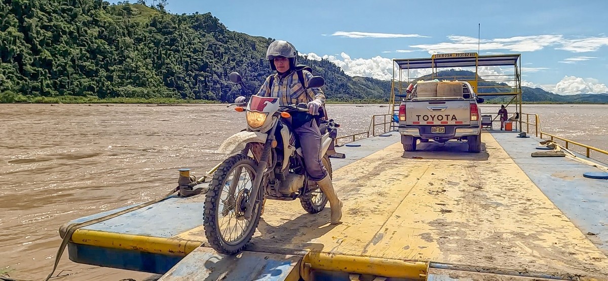 Woman drives motorbike off river ferry