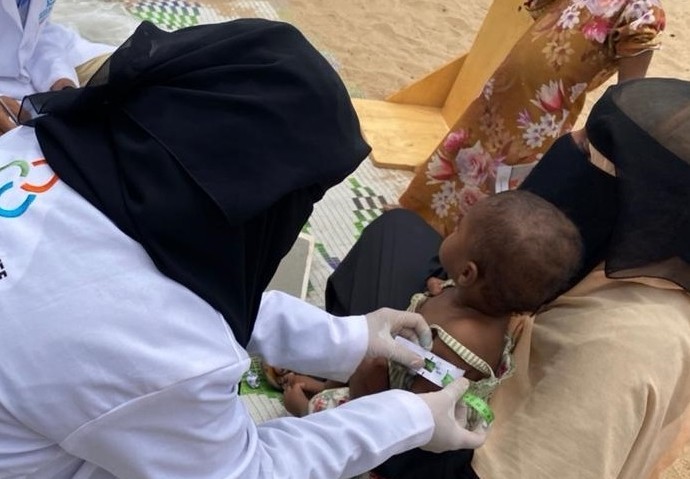 A child is assessed for malnutrition at an IDP camp by Corus International health care workers