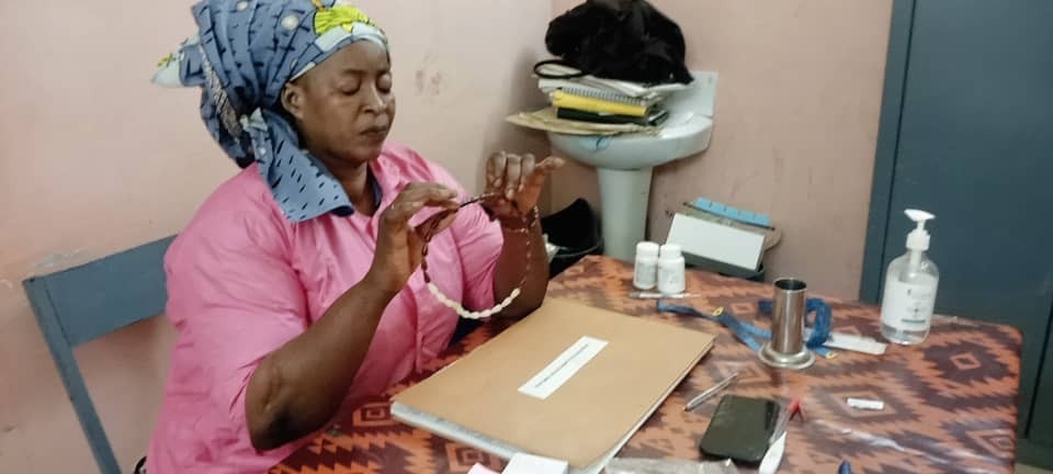 A woman from IMA World Health's MOMENTUM Integrated Health Resilience project conducts a family planning session