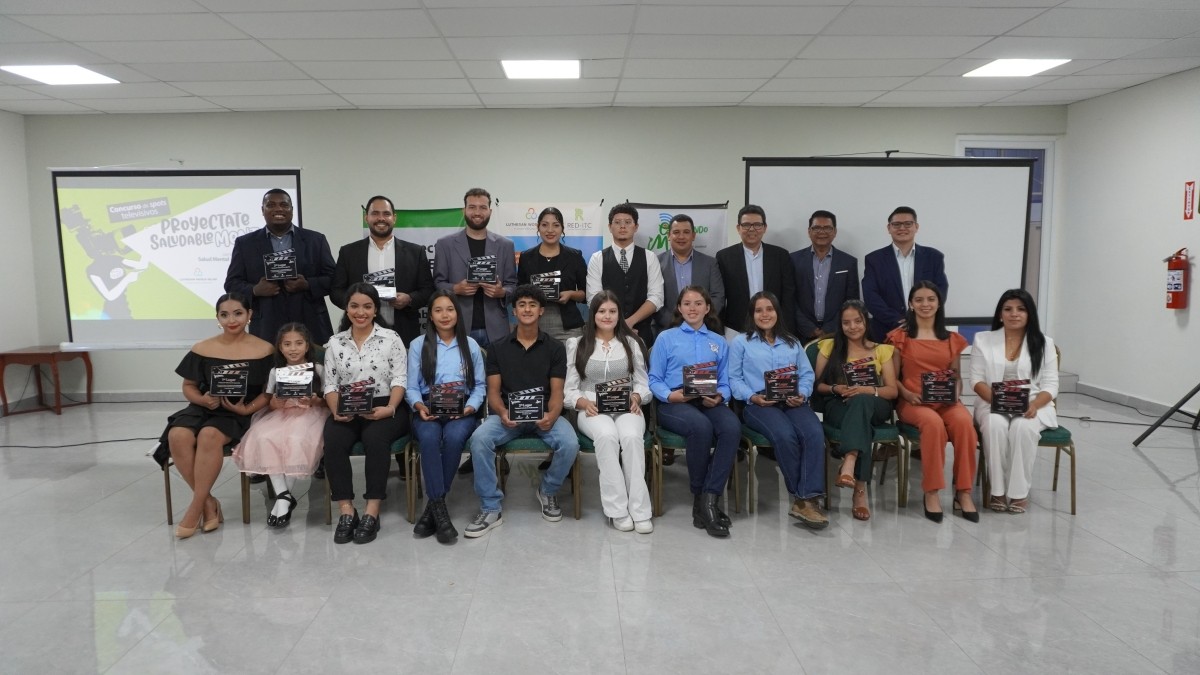 Two rows of people holding certificates and smiling