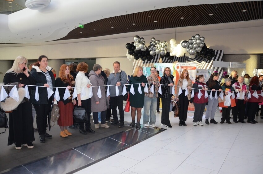 Participants take part in the Her Handkerchief installation in Kharkiv, Ukraine.