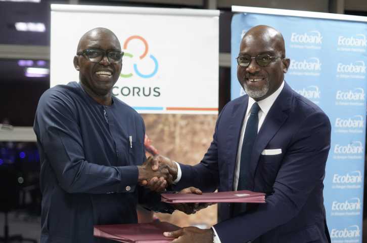 Corus and Ecobank leaders shake hands after signing MOU.