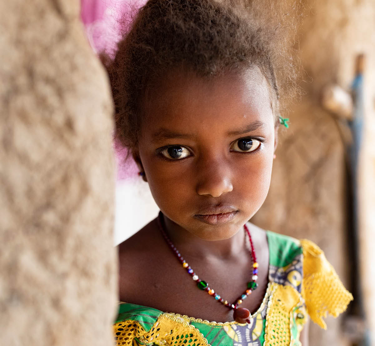 Aichata Sidibe (not pictured) is the mother of three children, who is expecting a fourth  They live in a small, single room hut in the village of Siemana, Mali, while her husband has left the area to find work  Finding enough food to feed the family presents a constant challenge, and the children are often hungry   When the children don t get food they get sick,  she said   It s not for very long but I have to then rely on God    Pictured here is Aichata s namesake daughter, Aichata (6)   Sahel 2021 Crisis; Barouéli Cercle, Mali  Feb 23, 2021  Photo by Jake Lyell 